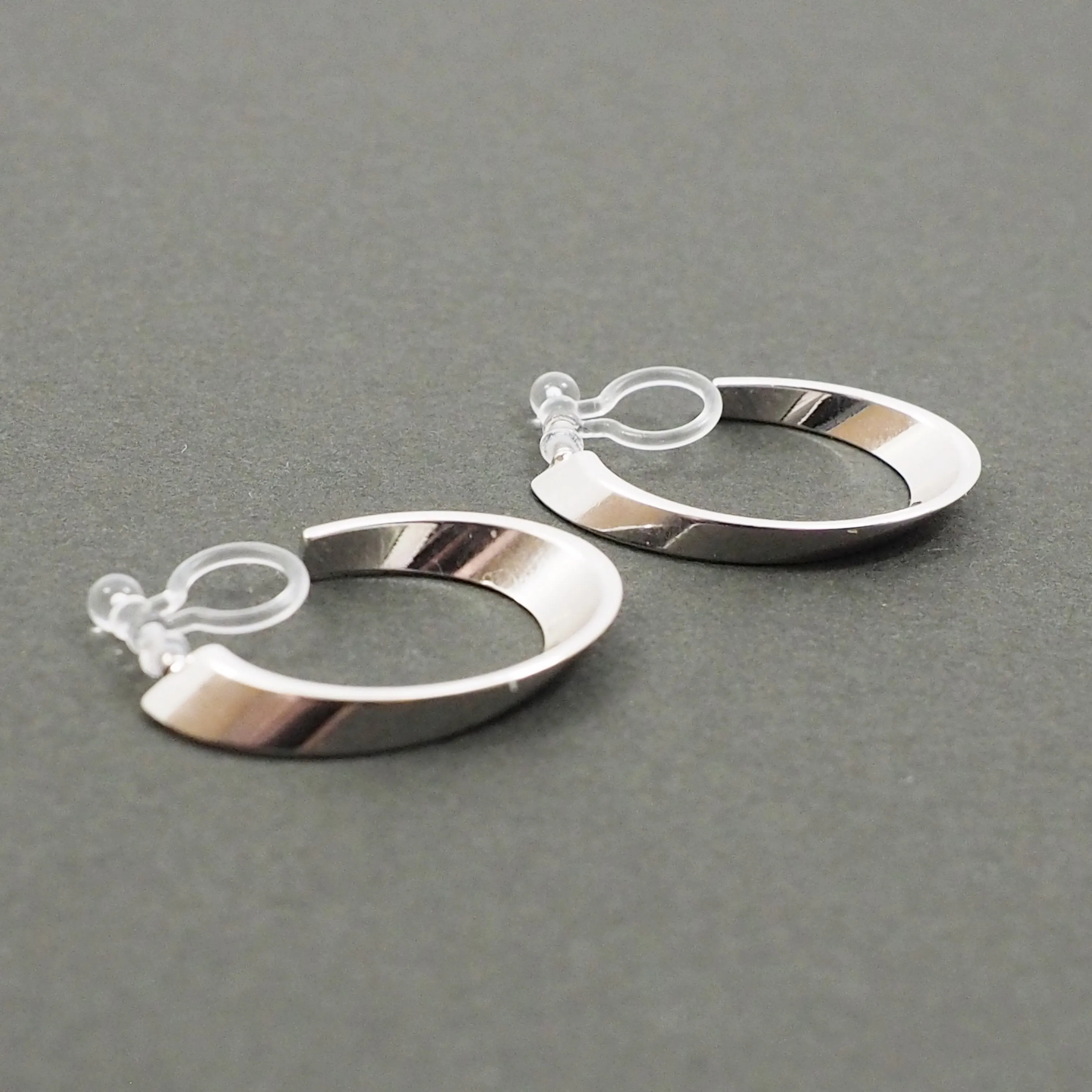 Silver Twisted Oval Invisible Clip On Hoop Earrings
