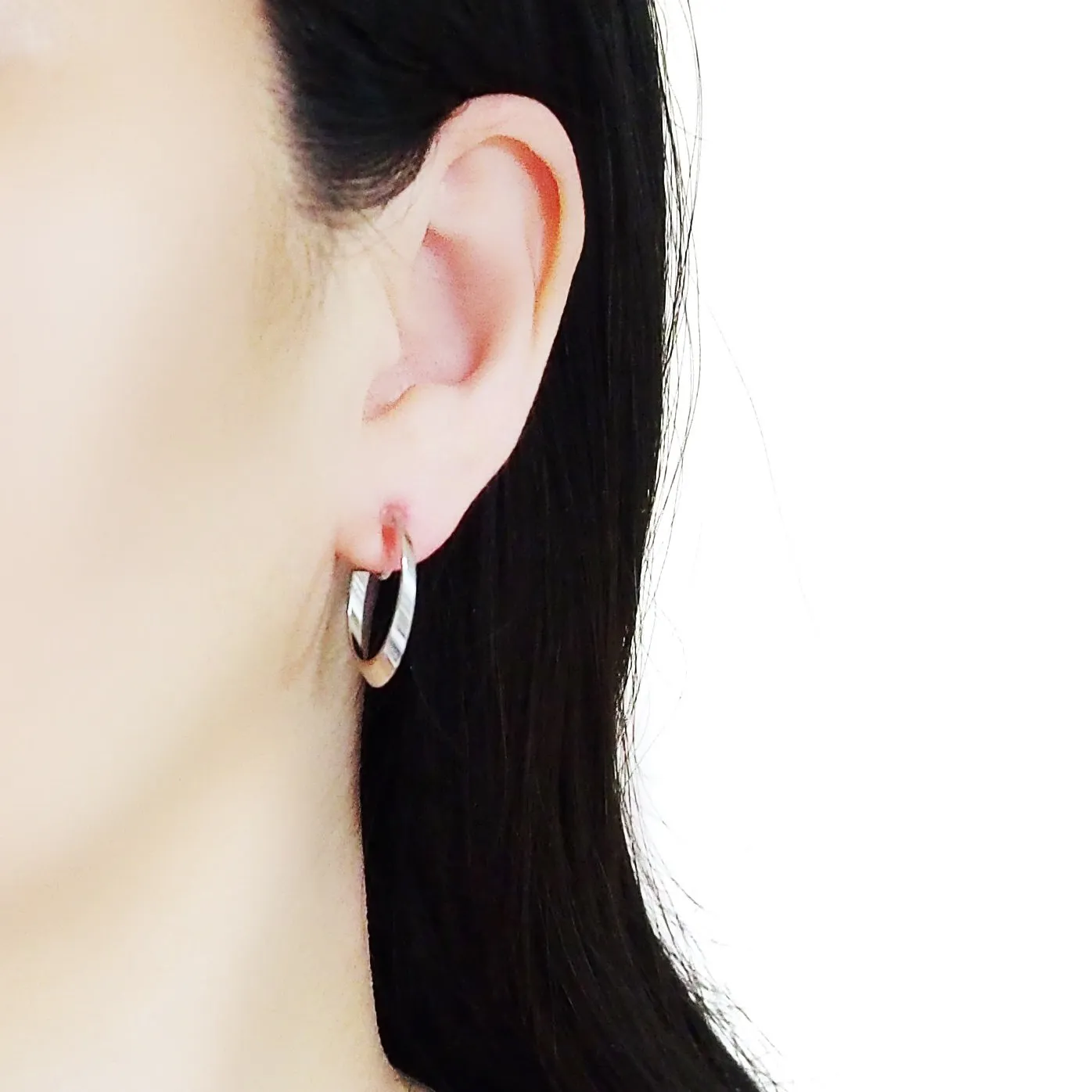 Silver Twisted Oval Invisible Clip On Hoop Earrings